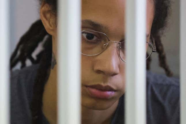 Brittney Griner, who was detained at Moscow’s Sheremetyevo airport and later charged with illegal possession of cannabis, waits for the verdict inside a defendants’ cage before a court hearing in Khimki outside Moscow, on August 4, 2022. (Photo by EVGENIA NOVOZHENINA / POOL / AFP) (Photo by EVGENIA NOVOZHENINA/POOL/AFP via Getty Images)