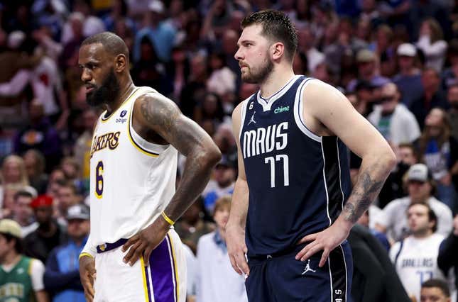 Feb 26, 2023; Dallas, Texas, USA; Los Angeles Lakers forward LeBron James (6) and Dallas Mavericks guard Luka Doncic (77) during the fourth quarter at American Airlines Center.
