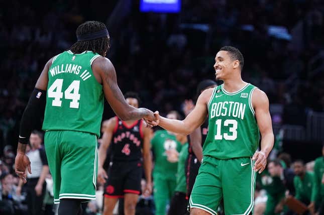 Apr 5, 2023; Boston, Massachusetts, USA; Boston Celtics guard Malcolm Brogdon (13) reacts after his three point basket with center Robert Williams III (44) against the Toronto Raptors in the second quarter at TD Garden.