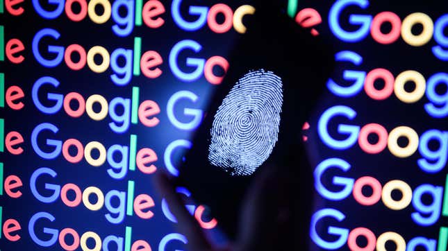 A thumbprint on a mobile phone in front of the Google logo.