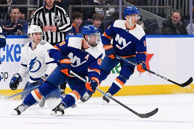 Apr 6, 2023; Elmont, New York, USA; New York Islanders center Brock Nelson (29) keeps the puck in his zone against the Tampa Bay Lightning during the first period at UBS Arena.