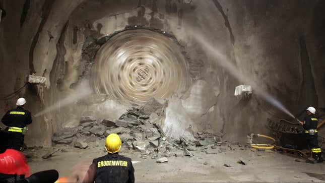 The tunnel drilling machine "Sissi" breaks through the last section of the Gotthard Base Tunnel near Sedrun in the canton of Grisons, Switzerland, Oct. 15, 2010. With 57 kilometers (35-miles) the new St. Gotthard tunnel is the world's longest tunnel. The 13.157 billion Swiss francs (9.6 billion euro, 13.6 billion US dollars) Alptransit project, which is due to be operational in 2016, constitutes the center piece of the New Railway Link through the Alps. (AP Photo/Keystone/Arno Balzarini