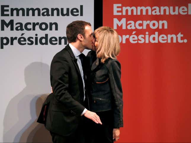 Macron kisses his wife at a meeting for Women’s Day in Paris.