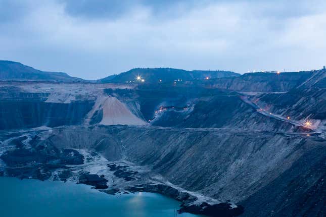 Seen from a distance, the orange embers of the perpetual fire in Dipka coal mine near Hardi Bazar, Korba. The fire likely extends further underground.