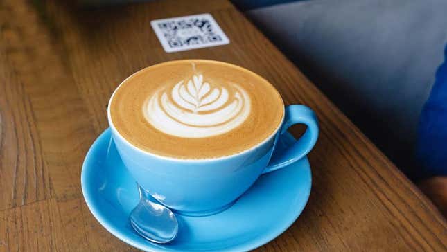 cafe latte beside QR code menu