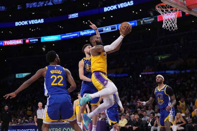 May 8, 2023; Los Angeles, California, USA; Los Angeles Lakers forward LeBron James (6) shoots the ball against Golden State Warriors forward Andrew Wiggins (22) and guard Klay Thompson (11) during game four of the 2023 NBA playoffs at Crypto.com Arena.