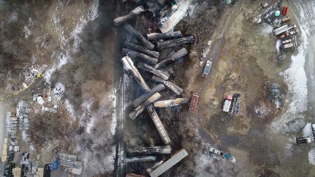 A photo of the Ohio train crash from above with rail cars spread around the scene. 