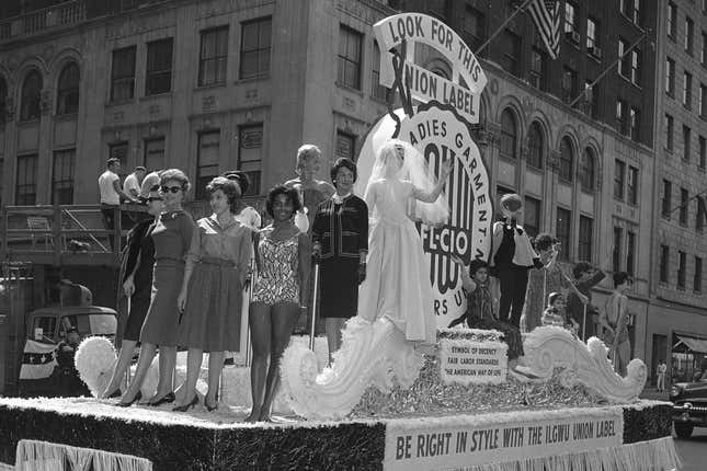 File - Members of the International Ladies&#39; Garment Workers&#39; Union are seen on a Labor Day parade float, Sept. 4, 1961. Labor Day, 2023, is right around the corner. And while many may associate the holiday with major retail sales and end-of summer barbecues, Labor Day&#39;s roots in worker-driven organizing feel especially significant this year. (AP Photo/Hans Von Nolde, File)
