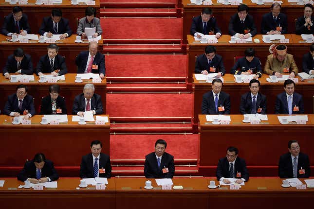 Xi Jinping presides over a meeting of the National Peoples Congress.