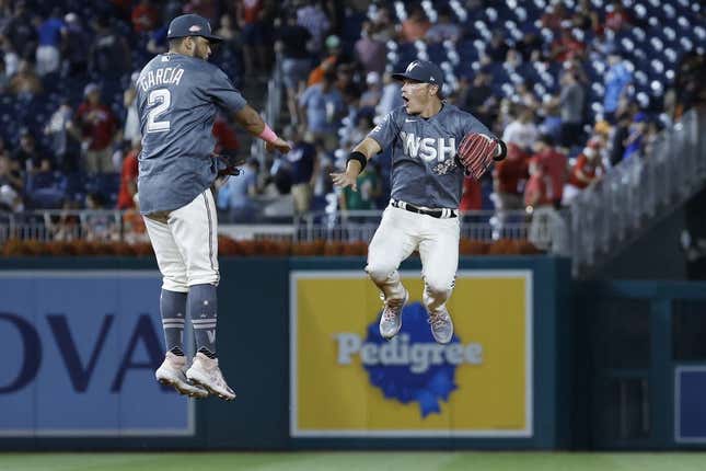 Jul 22, 2023; Washington, District of Columbia, USA; Washington Nationals second baseman Luis Garcia (2) celebrates with Nationals center fielder Alex Call (17) after their game against the San Francisco Giants at Nationals Park.