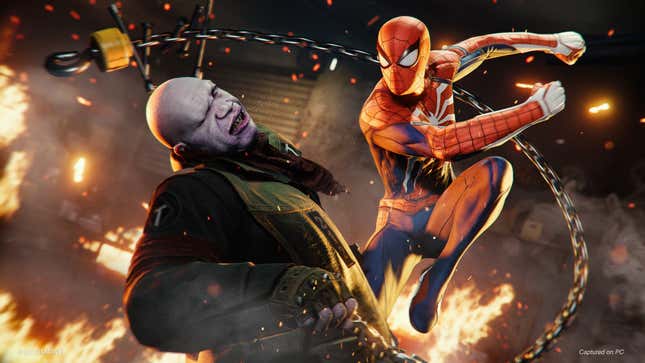 Spider-Man in Marvel's Spider-Man is punching up as bad guy with flames raging in the background.