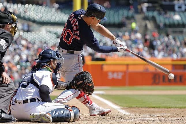 Apr 9, 2023; Detroit, Michigan, USA; Boston Red Sox right fielder Rob Refsnyder (30) hits an RBI single in the fifth inning against the Detroit Tigers at Comerica Park.