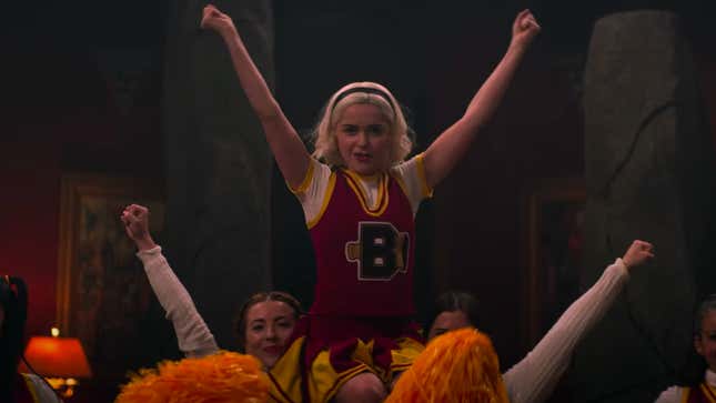Sabrina Spellman in performing a cheer routine with some fellow youths.