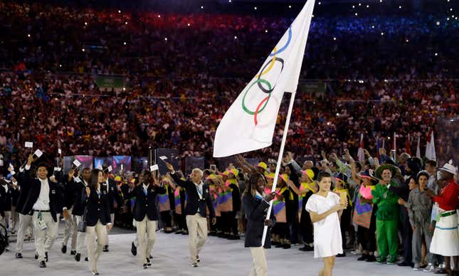 Rose Lokonyen Nathike carries the flag of Refugee Olympic Team during the opening ceremony for the 2016 Summer Olympics in Rio de Janeiro, Brazil, Friday, Aug. 5, 2016. (AP Photo/David J. Phillip)