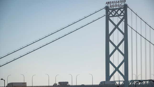 Vehicles travel across the Ambassador Bridge that connects Detroit and Windsor, Canada on November 8, 2021 in Detroit, Michigan