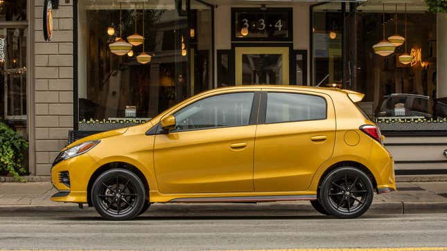Side view of a gold 2023 Mitsubishi Mirage five-door hatch.