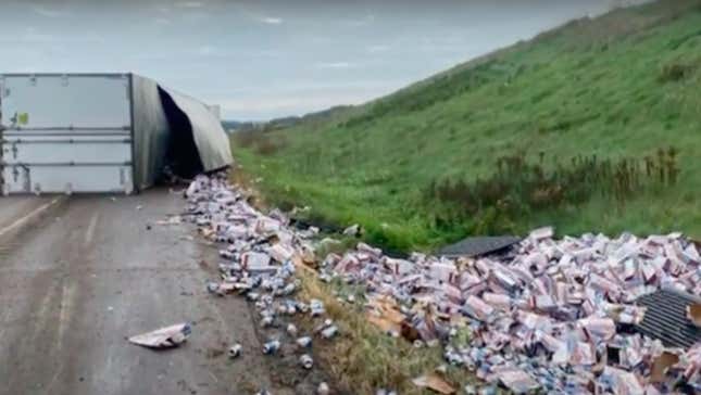 Screenshot of overturned truck with beer all over highway
