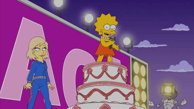 A screenshot from The Simpsons shows Lisa on top of a cake near Lady Gaga. 