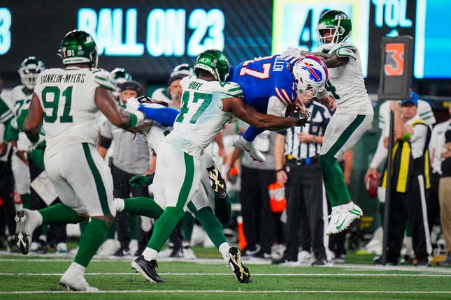 Josh Allen tries to make his way through the New York Jets stout defense