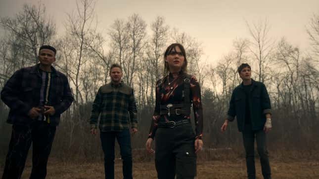 Kinsey and Tyler Locke (center right, Emilia Jones and Connor Jessup) look at a sinister threat while Scot (far left, Petrice Jones) and Will (Aaron Ashmore, center left) join them.