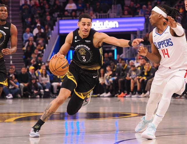 Mar 2, 2023; San Francisco, California, USA; Golden State Warriors guard Jordan Poole (3) drives in against Los Angeles Clippers shooting guard Terance Mann (14) during the first quarter at Chase Center.