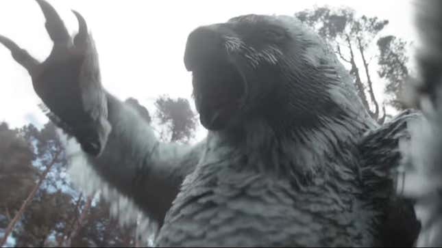 An owlbear roars and raises its giant talons to claw at a soldier.