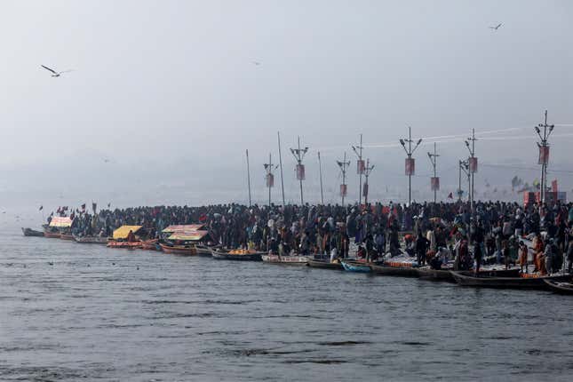 Devotees take a holy dip in Prayagraj on Jan. 14.