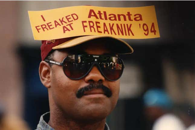 William Stimms stands on Peachtree St. downtown with a sticker on his hat watching the crowds go by on foot at Freaknik, Atlanta, Georgia, April 23, 1994.