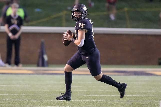 Sep 1, 2022; Winston-Salem, North Carolina, USA; Wake Forest Demon Deacons quarterback Mitch Griffis (12) scrambles out of the pocket to pass against the Virginia Military Institute Keydets during the first half at Truist Field.
