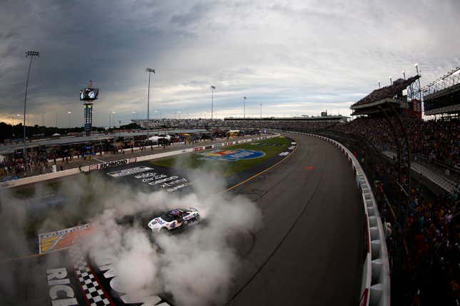 Kevin Harvick, driver of the No. 4 Mobil 1 Ford, celebrates with a burnout after winning the NASCAR Cup Series Federated Auto Parts 400 at Richmond Raceway on August 14, 2022 in Richmond, Virginia.