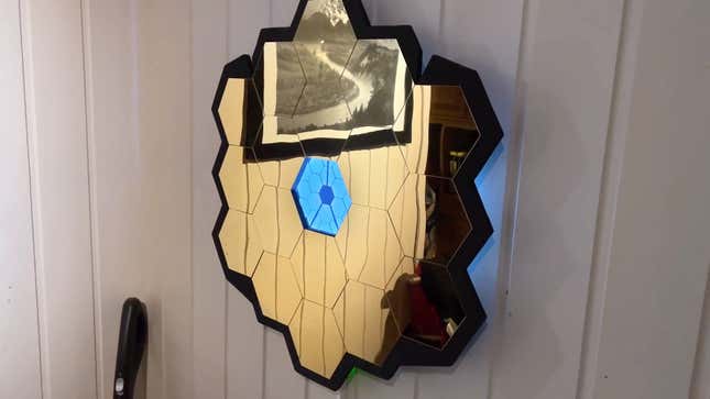 A custom-built decorative piece that celebrates the science and engineering of the JWST.