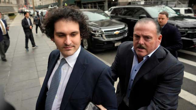 FTX founder Sam Bankman-Fried, left, arrives at Manhattan federal court on Feb. 16, 2023, in New York
