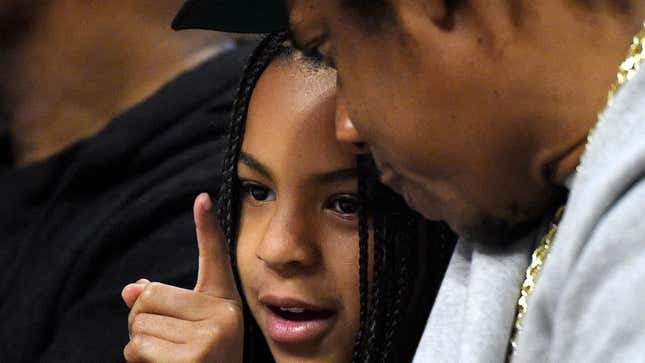 Jay-Z, right, sits with his daughter Blue Ivy during the second half of an NBA basketball game between the Los Angeles and the Los Angeles Lakers Sunday, March 8, 2020.