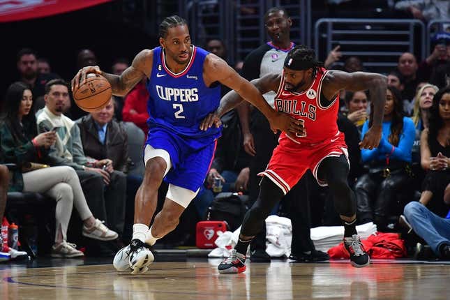 Mar 27, 2023; Los Angeles, California, USA; Los Angeles Clippers forward Kawhi Leonard (2) moves the ball against Chicago Bulls guard Patrick Beverley (21) during the first half at Crypto.com Arena.