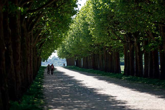 An elderly couple enjoy a walk at the Parc de l'observatoire in Meudon, near Paris, as warm and sunny weather continues in France