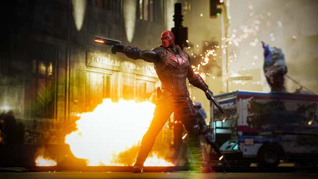 Jason "Red Hood" Todd strikes a cool pose in front of an explosion, shooting his gun off-screen (probably) at some bad guys.