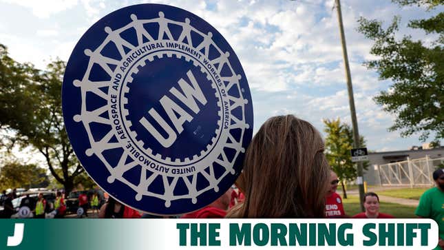 A photo of a UAW member marching in a Labor Day parade. 