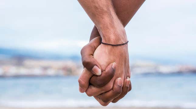 Image for article titled A Child Was Traumatized by Poster of People of Different Races Holding Hands?!