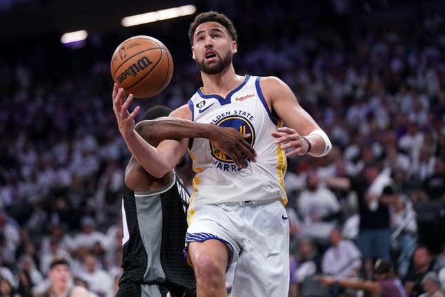 Apr 15, 2023; Sacramento, California, USA; Golden State Warriors guard Klay Thompson (11) is hit by Sacramento Kings forward Harrison Barnes (40) in the third quarter during game one of the 2023 NBA playoffs at the Golden 1 Center.