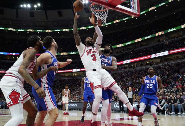 Mar 22, 2023; Chicago, Illinois, USA; Philadelphia 76ers center Joel Embiid (21) defends Chicago Bulls center Andre Drummond (3) during the first quarter at United Center.