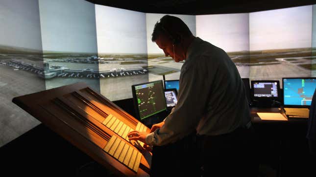 An air traffic controller works inside an airport tower simulator on July 14, 2011 at the Denver International Airport in Denver, Colorado