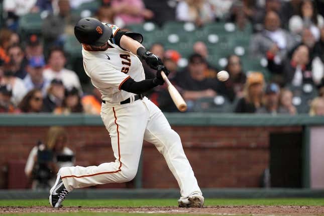Jun 10, 2023; San Francisco, California, USA; San Francisco Giants left fielder Mitch Haniger (17) hits a double against the Chicago Cubs during the eighth inning at Oracle Park.