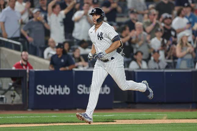 Apr 14, 2023; Bronx, New York, USA; New York Yankees right fielder Giancarlo Stanton (27) runs the base path after hitting a solo home run during the sixth inning against the Minnesota Twins at Yankee Stadium.