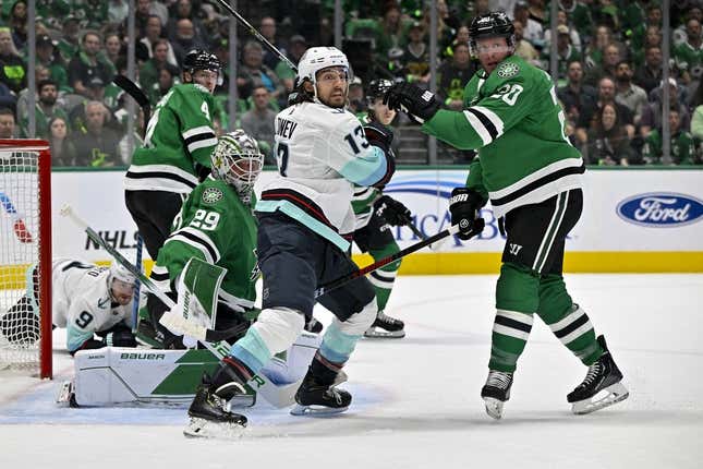 May 4, 2023; Dallas, Texas, USA; Dallas Stars goaltender Jake Oettinger (29) and defenseman Ryan Suter (20) and Seattle Kraken left wing Brandon Tanev (13) look for the puck in the Stars zone during the first period in game two of the second round of the 2023 Stanley Cup Playoffs at Scotiabank Arena.