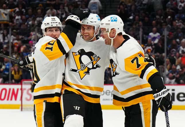 Mar 22, 2023; Denver, Colorado, USA; Pittsburgh Penguins center Jeff Carter (77) celebrates his goal with defenseman Brian Dumoulin (8) and left wing Drew O&#39;Connor (10) in the third period against the Colorado Avalanche at Ball Arena.