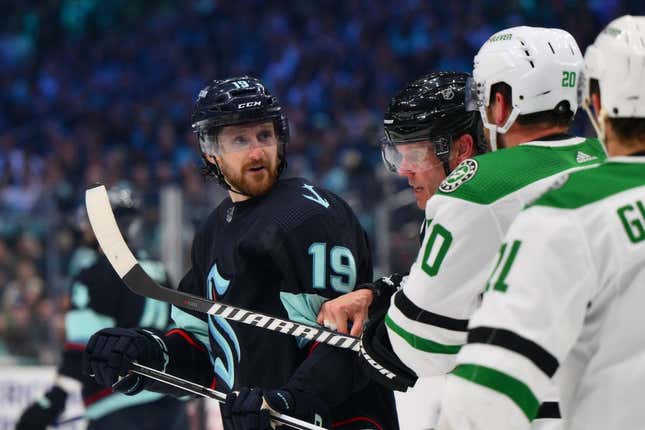 May 9, 2023; Seattle, Washington, USA; Seattle Kraken left wing Jared McCann (19) is separated from Dallas Stars defenseman Ryan Suter (20) during the second period in game four of the second round of the 2023 Stanley Cup Playoffs at Climate Pledge Arena.