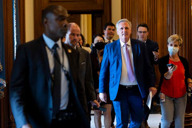House Minority Leader Kevin McCarthy (R-CA) is followed by reporters as he walks to his office in the U.S. Capitol Building on May 12, 2022, in Washington, DC. 