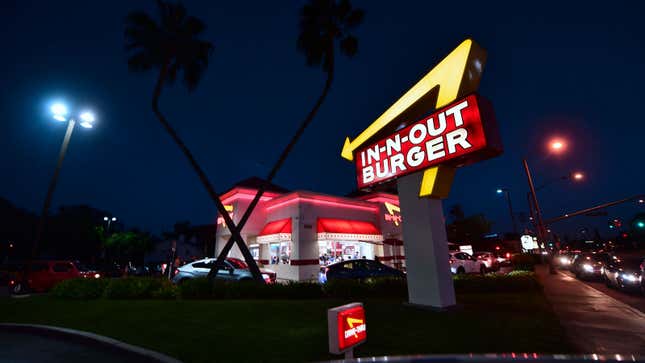 A photo of an In-N-Out restaurant at night. 