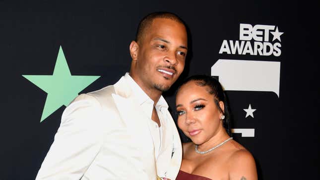 T.I. &amp; Tameka “Tiny” Harris pose in the press room at the 2019 BET Awards on June 23, 2019.