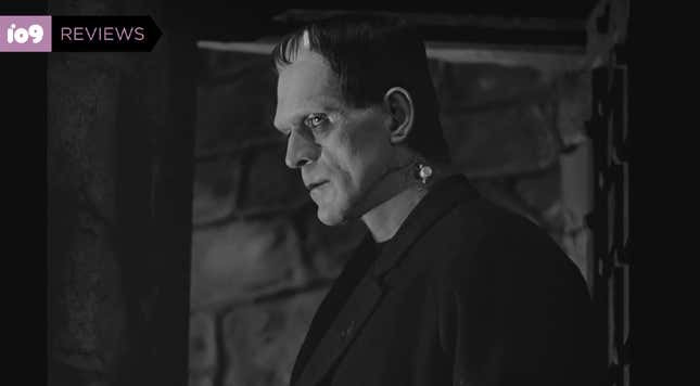 Boris Karloff in his Frankenstein make-up stands in profile in a scene from the film.
